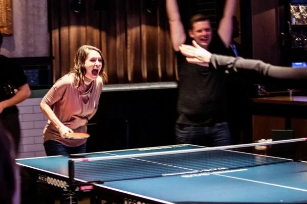 Friends playing table tennis