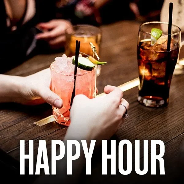 Happy Hour cocktails on a bar table.